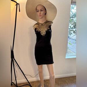 Elegant Black and Gold Dress with sheer back. Gently used!Gorgeous evening dress